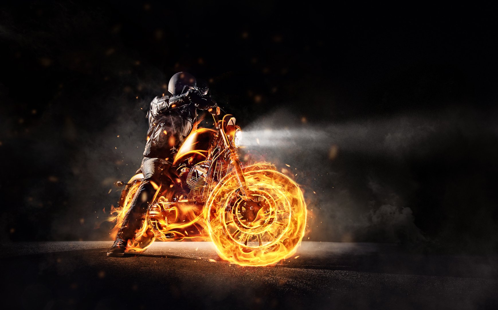 Dark Motorbiker Staying on Burning Motorcycle